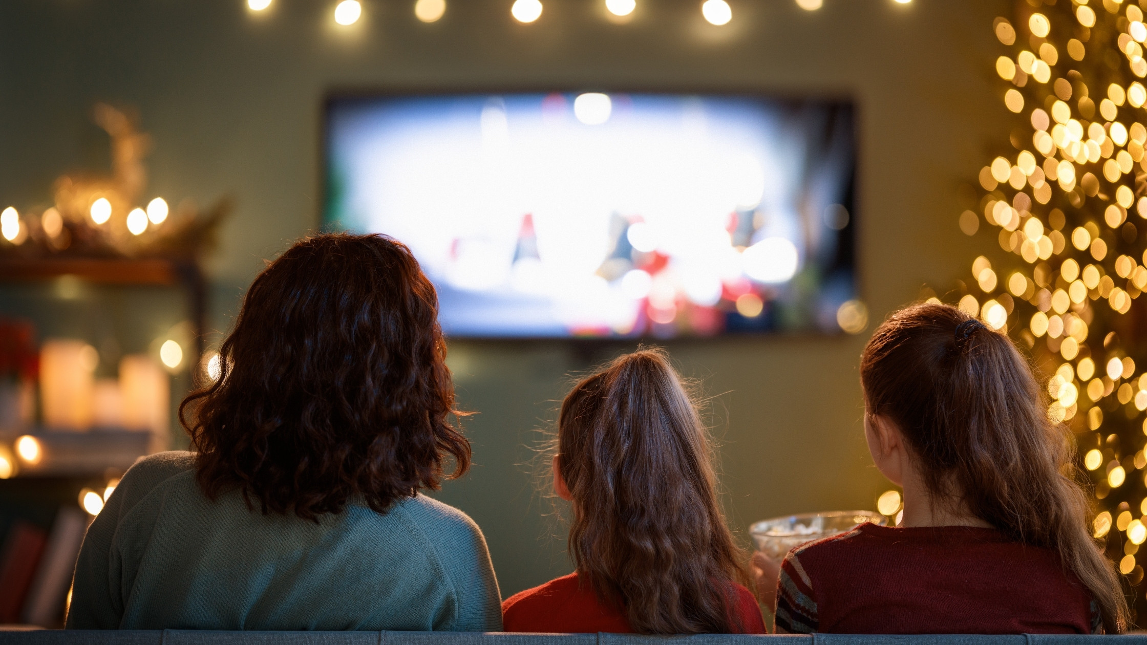 family watching tv around the holidays